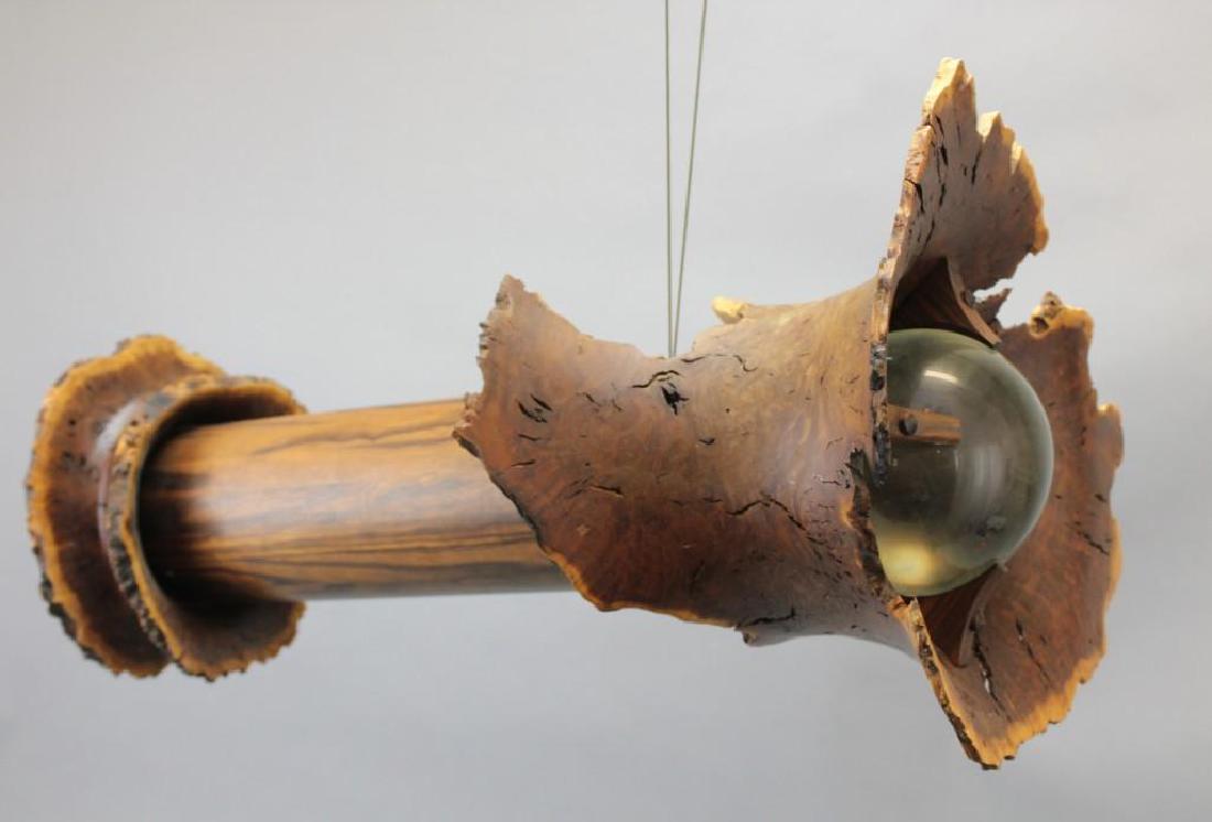 Burl Wood Kaleidoscope: Circa 2000. Ceiling hanging log/trunk shape natural wood with Unmarked, unique glass sphere 21"L.