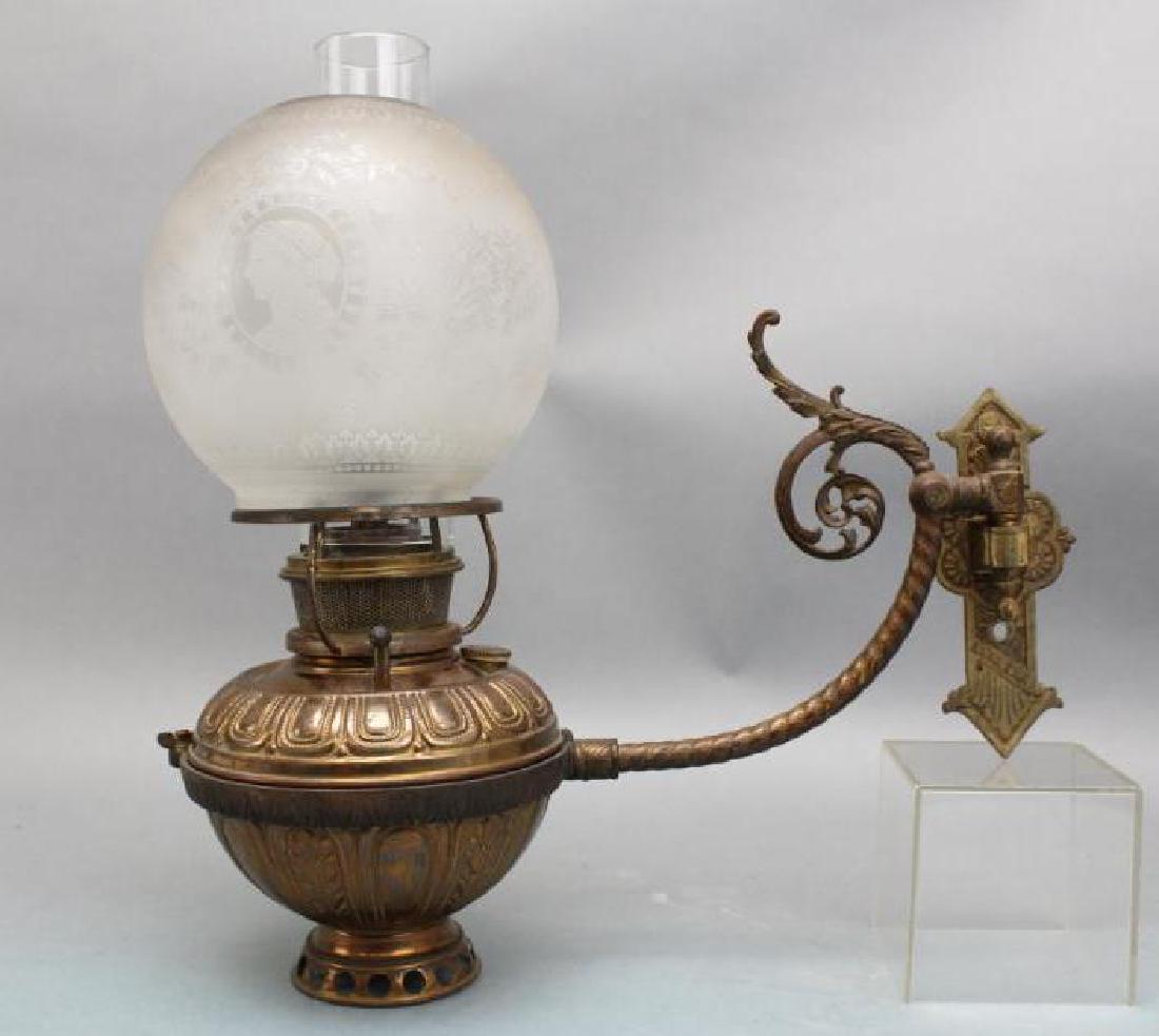 Bradley and Hubbard Kerosene Wall Sconce: Signed burner and well lid, with etched globe with portraits and ribbons. 15"H x 6.5"W x 15"d