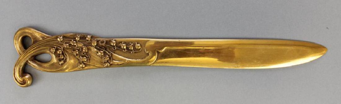 Art Nouveau Letter Opener: Signed R. Heymer and hallmarked Fumier et Cie. Lily of the valley motif, gilt bronze. 12"L x 2.25"W