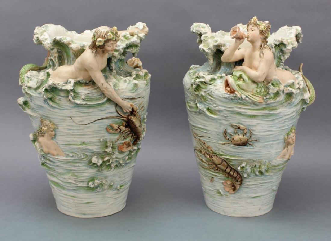 Royal Dux Mermaid Vases: Two vases depicting mermaid, mermen and other aquatic sea life, including turtles and lobsters. 15" H x 10.5" Round