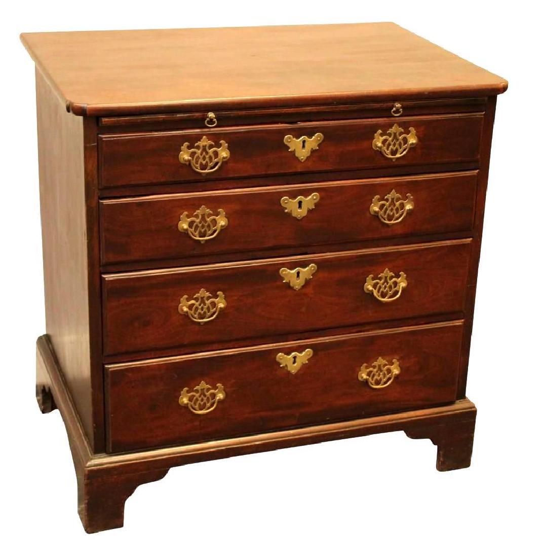 Chippendale Chest: Four drawer chest with slide out surface and ogee bracket feet. Measures 30"H x 30"W x 20"D.