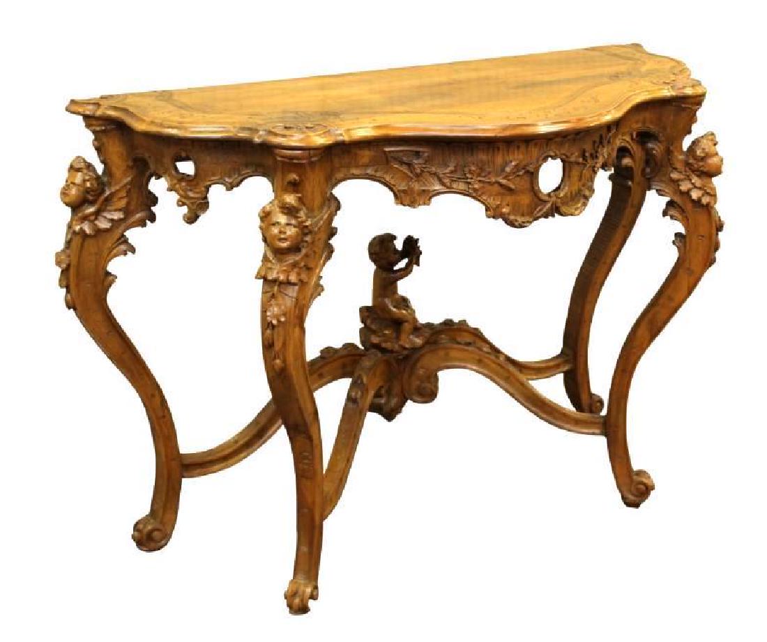 Rococo Carved Console: Carved wood console with scrolled top with carved shells, cherub carved cabriole legs and stretcher cherub finial. Measures 33.5"H x 47"W x 20"D.