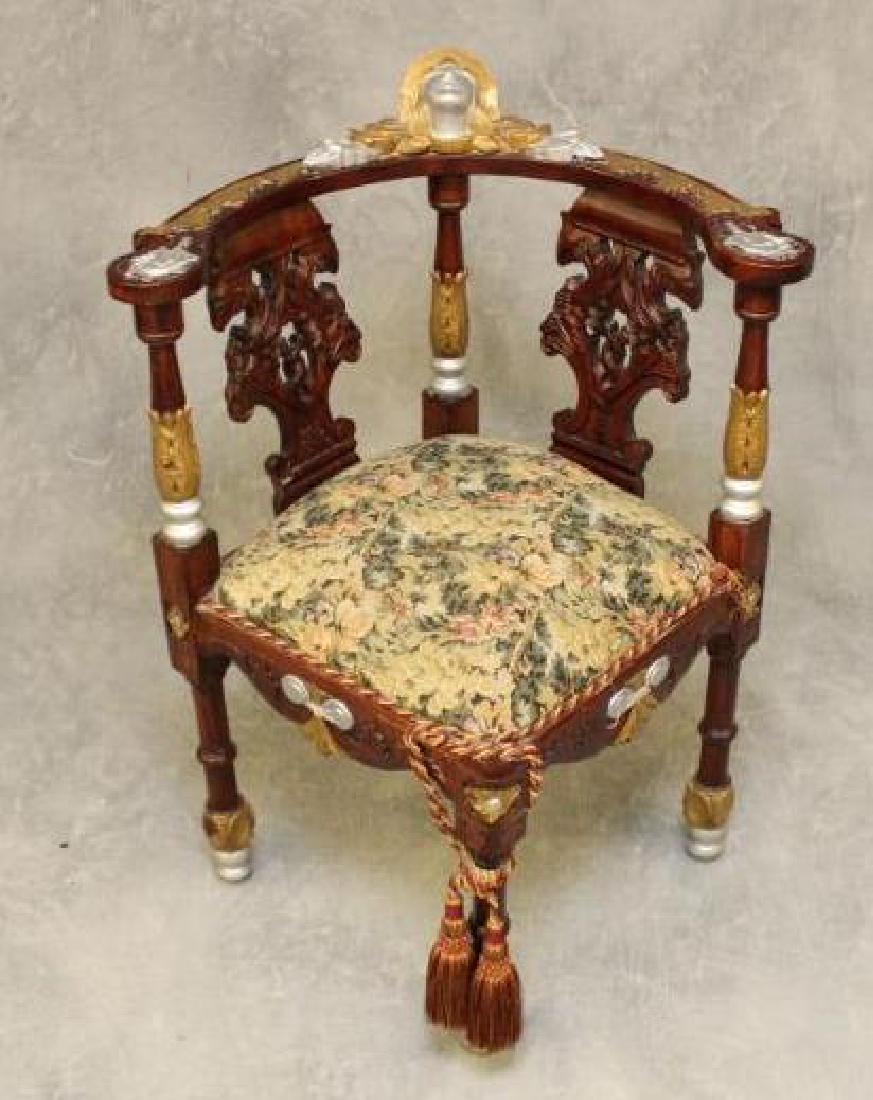 Corner Armchair: Paint decorated and carved corner armchair with upholstered seat. 28"w x 26"d x 35"h.