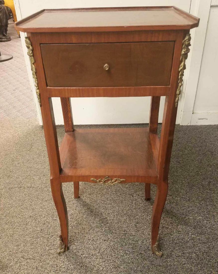 Side Table: Single drawer over shelf with ormolu accents on legs. 15"w x 11" x 30"h.Â
