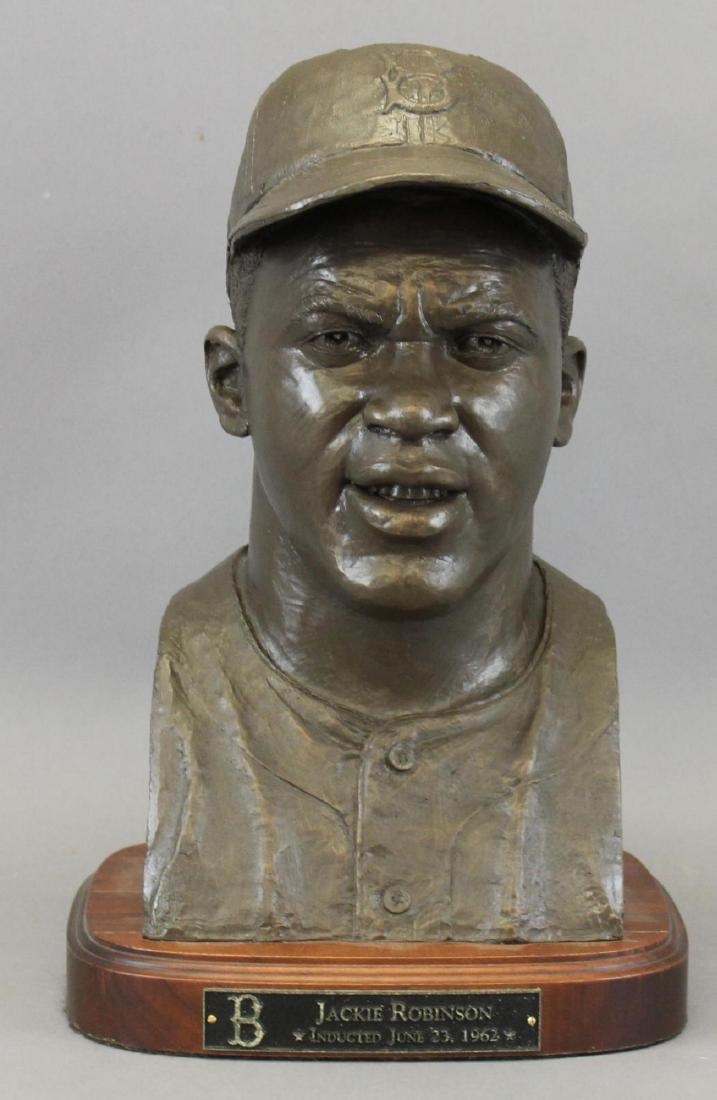 Bust Portrait Sculpture of Jackie Robinson: Limited edition life sized bust of Jackie Robinson in bronzed resin measuring 16"H mounted on 1.75" wood base with plaque "Jackie Robinson, Inducted July 23, 1962,". This limited edition is marked on