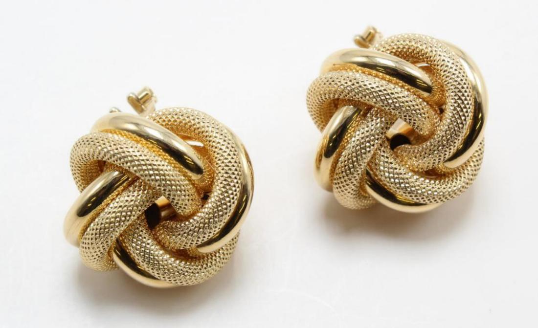 18K Yellow Gold Knot Earrings. Omega Back Pierced: 7/8". textured and polished loops. 12.5gtw.