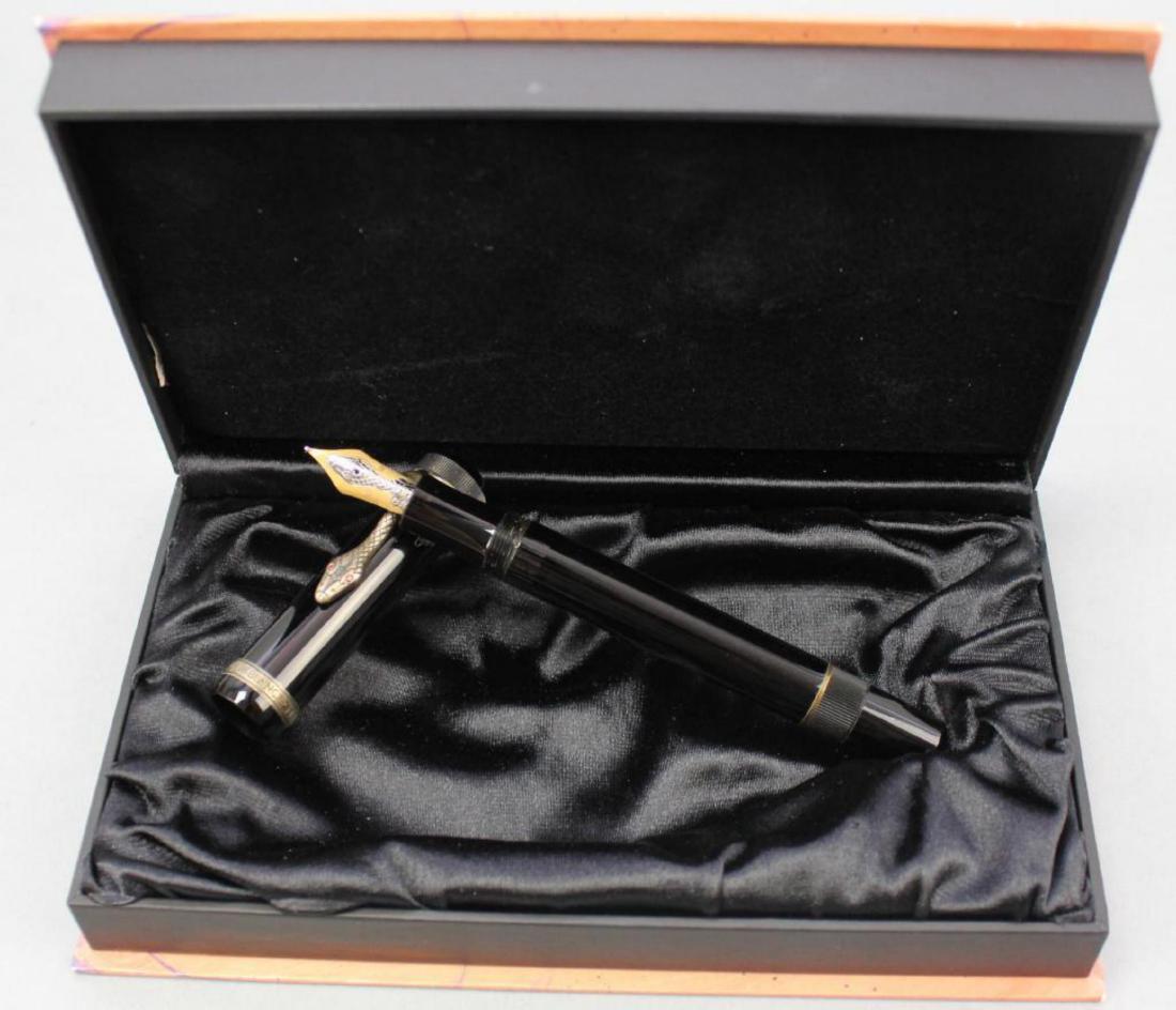 Montblanc Writers Edition "Agatha Christie" Fountain: Around the cap, made of black precious resin, winds a snake made of 925 sterling silver with ruby eyes that serves as a clip. Includes original box 2"H x 7.5"W x 4.5"D