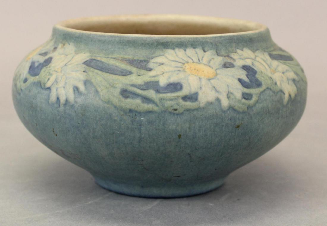 Newcomb College Art Pottery Matte Glaze Bowl: Anne Francis Simpson, with a wreath of daisies, base marked with Newcomb cipher, decorator's mark, Joseph Meyer's potter's mark, reg. no. GM97, shape no. 256 and C for buff clay body. 3.5"H x 6.25"Rou