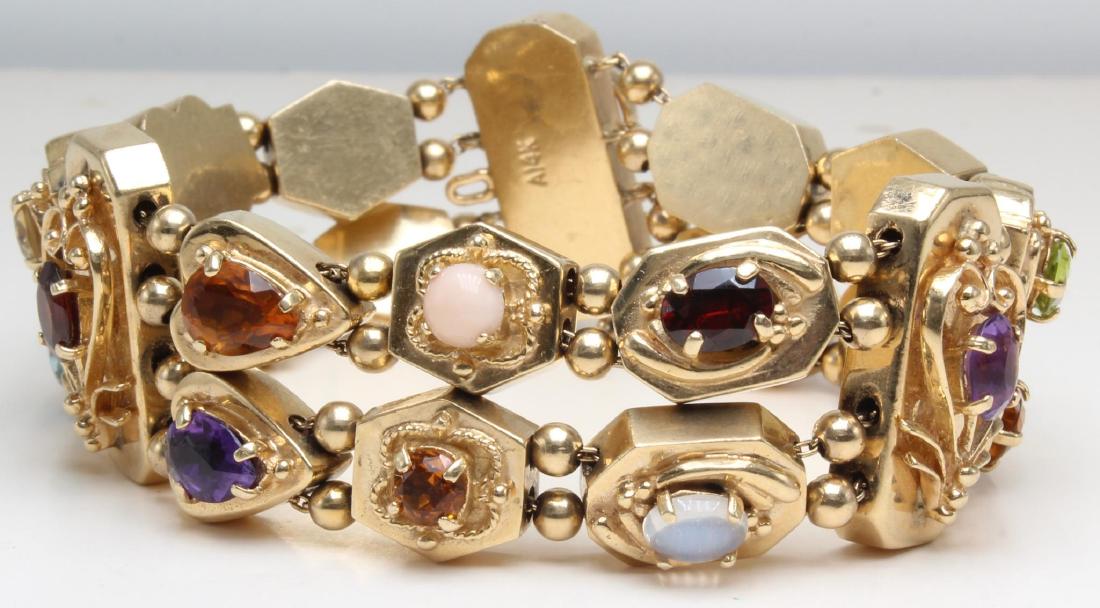 Bracelet. Slides. Gemstones. 14K Yellow Gold: 7 1/2 X1". Including Amethyst, Citrine, Garnet, Lapis, Peridot, blue Zircon. 70.9gtw.