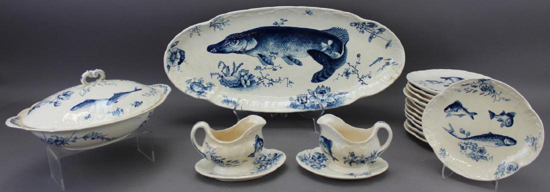 Villeroy and Boch Delphin China: Grouping of Villeroy and Boch Mettlach, Delphin pattern includes platter measuring 23" x 10" (damaged), (12) plates measuring 9" x 8", covered casserole (handle on lid has been repaired) and (2) grav