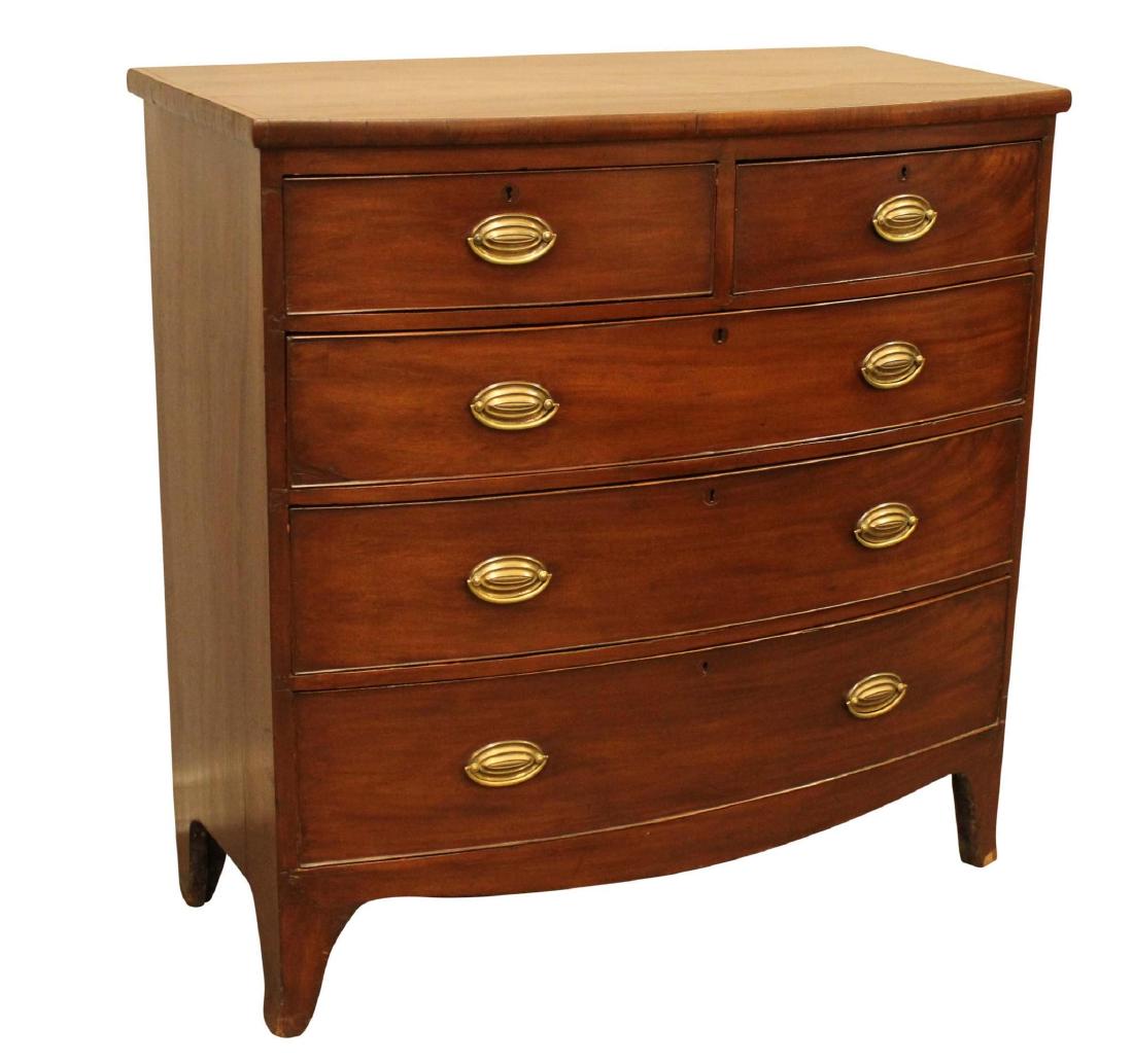 Hepplewhite Chest of Drawers: Five drawer chest with brass hardware and tapered legs. Measures 40"w x 20"d x 41"h. Wood chip on bottom right leg.