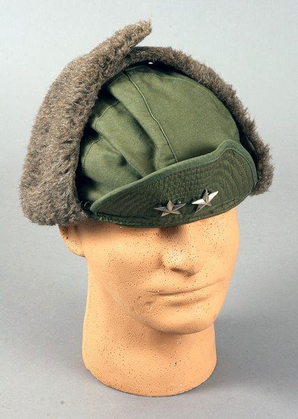Lemnitzer Hat: Hat being a "cap, field, pile, M-1951" featuring silver pin stars of Major General. Sold with 8x10 matted photograph of Lemnitzer wearing similar style hat during Korean War. Provenance: General Lyman