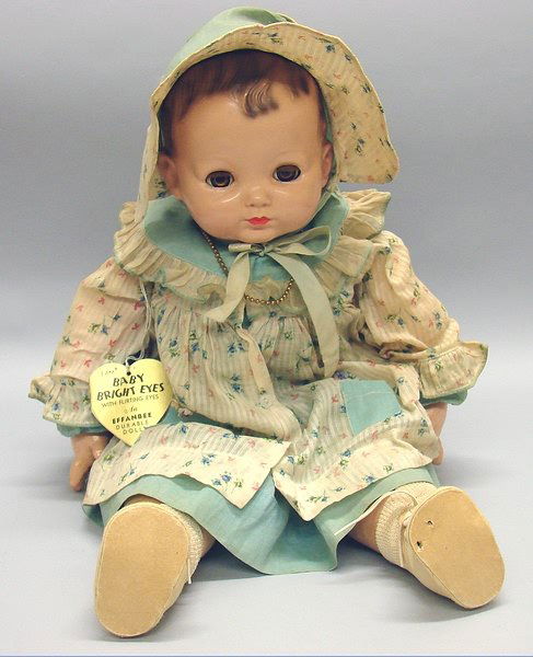 Composition.: 22" 1939-1949 Effanbee "Baby Bright Eyes" with Flirting Eyes. Compo head and hands show crazing. Brown flirty sleep eyes have good color. Paint is in very good condition. Peach cotton torso and arms.