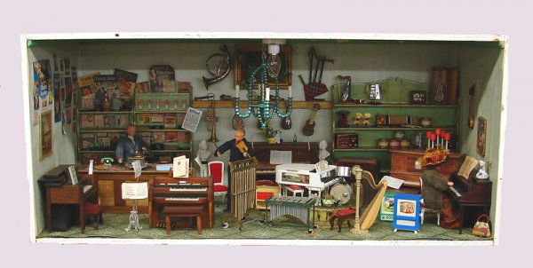 Diorama.: Music Room. Modern and antique pcs. German dollhouse dolls. Furnishings included Baldwin organ, player piano, upright piano, mother of pearl inlay instruments, Petite Princess Royal grand piano. Glock