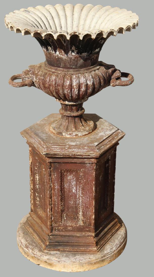 Cast Iron Garden Urn: On a conforming hexagonal base, 38”h x 19” diameter.