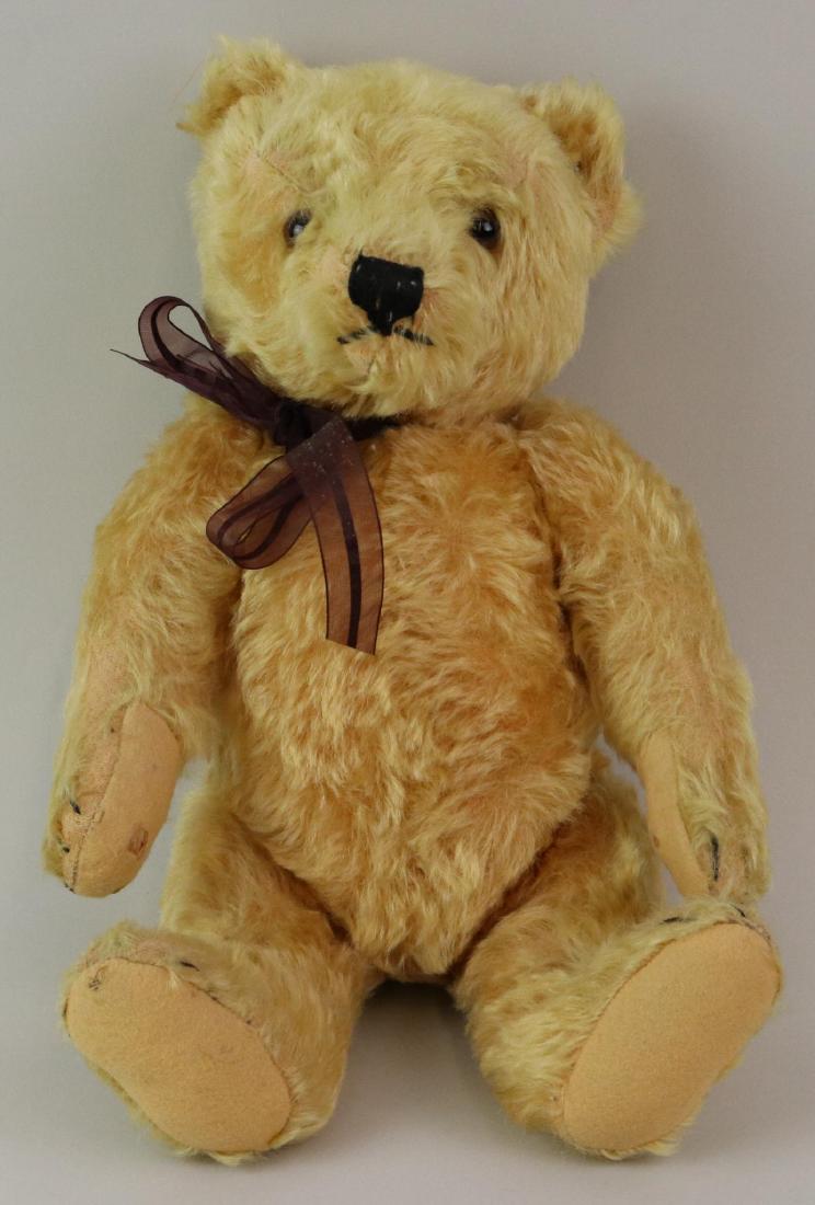 15" TAGGED ANTIQUE STEIFF MOHAIR TEDDY BEAR.: Bear is marked with upside down silver raised button. Gold mohair bear with amber glass eyes. Fully jointed with swivel head, camel felt pads, small hump on back. Squeaker still working. Condition: ag