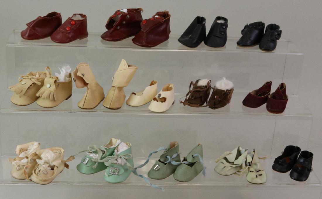 LOT OF DOLL ACCESSORIES: SHOES: Lot of (14) prs. of 1930's-40's oilcloth and suede shoes/boots. Includes 4 prs. of McGuffy style shoes. 2 Prs. with fringed flaps. Shoes are 2" - 3". Condition: this lot is being sold AS IS.