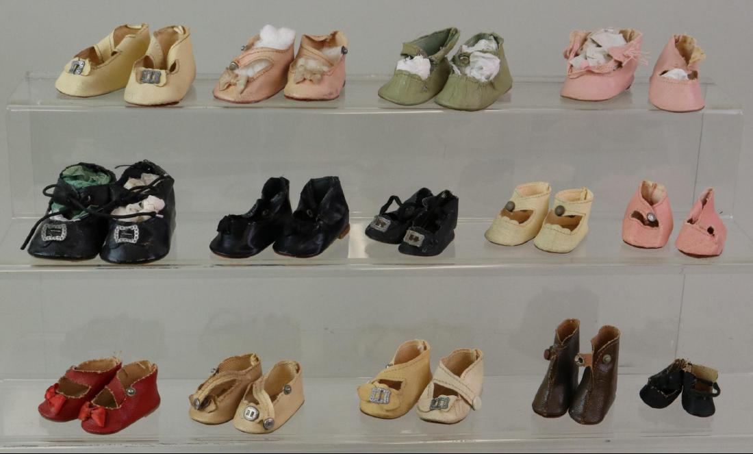 LOT OF DOLL ACCESSORIES: SHOES: Lot of (14) prs. of 1930's-40's oilcloth shoes/boots. They are 1 1/4" - 2 3/4". Condition: this lot is being sold AS IS.