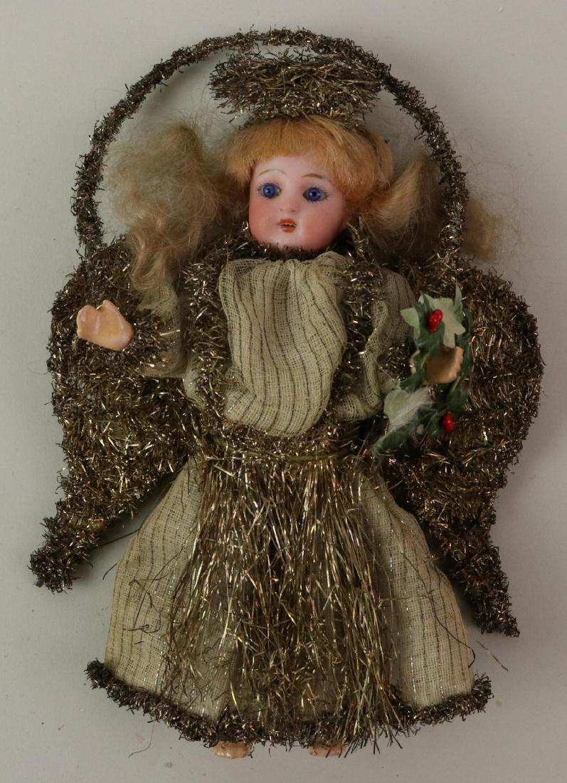 LOT OF HOLIDAY/NOVELTY ITEMS.: 7" Antique all original bisque head doll angel Christmas ornament. Head marked 878 2 with stationary eyes, open mouth, mohair wig. 5 Pc. papier mache body. Dressed in tinsel trimmed cotton clothing. L