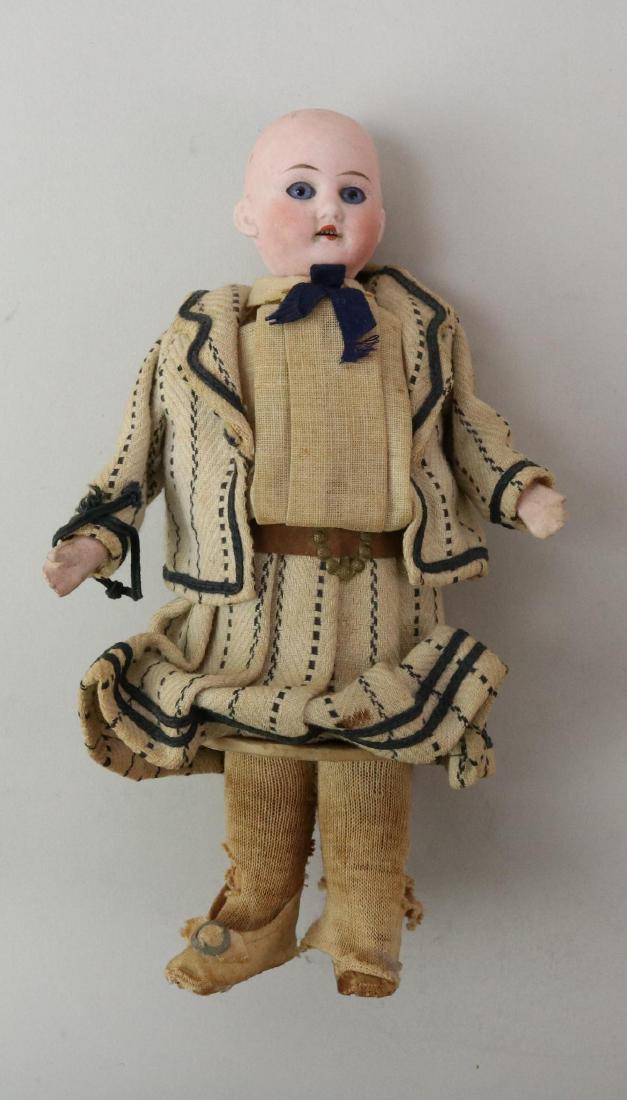 LOT OF HOLIDAY/NOVELTY ITEMS.: 7 1/2" Antique bisque head candy container marked G.H. Stationary blue eyes, open mouth. Papier mache arms, wooden legs. Bottom of canister is marked: D.R.G.M. 408292. All original clothing, dressed i
