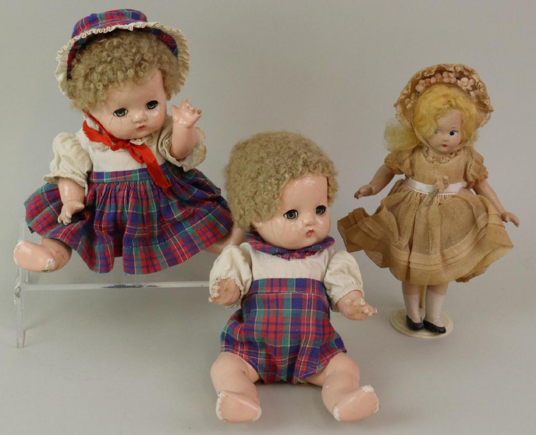 LOT OF (3) COMPOSITION DOLLS: F & B, ALEXANDER.: Pair of all original 9" Effanbee Patsy Babyette twins with sleep eyes, caracul wigs. Identical outfits. No shoes, socks. Condition: crazing. Paint loss on fingers, feet. 7" All original tagged, Madame