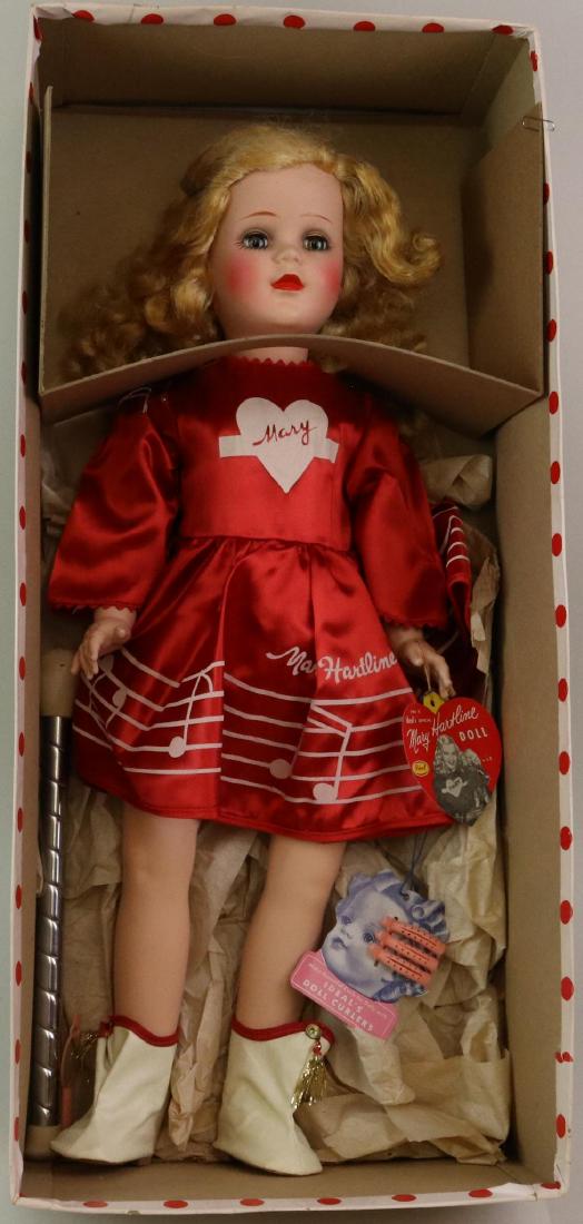 22 1/2"ALL ORIGINAL IDEAL "MARY HARTLINE", OB.: This doll has beautiful coloring and is dressed in the original red tafetta dress, matching panties, ivory oilcloth boots. She has her baton. Curler hangtag, original hangtag. Photo of Mary Hartline i