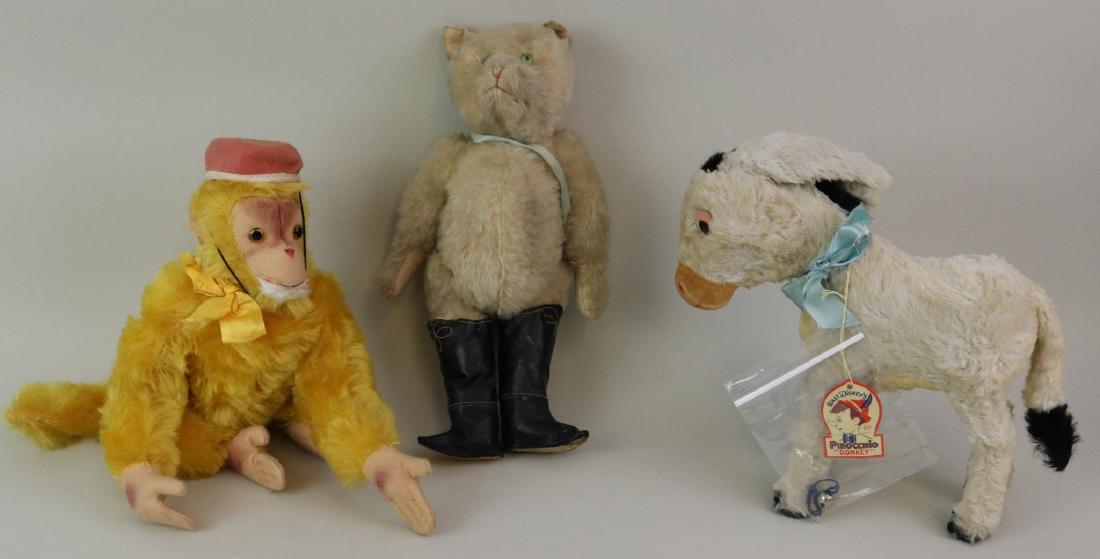 LOT OF (3) VINTAGE ANIMALS.: Mohair - 12" Unmarked gold mohair monkey with amber glass eyes. Felt face, ears, hands, feet. Wearing a red felt hat. 13" Unmarked Ivory Puss In Boots? Fully jointed cat with swivel head and tail. Gre