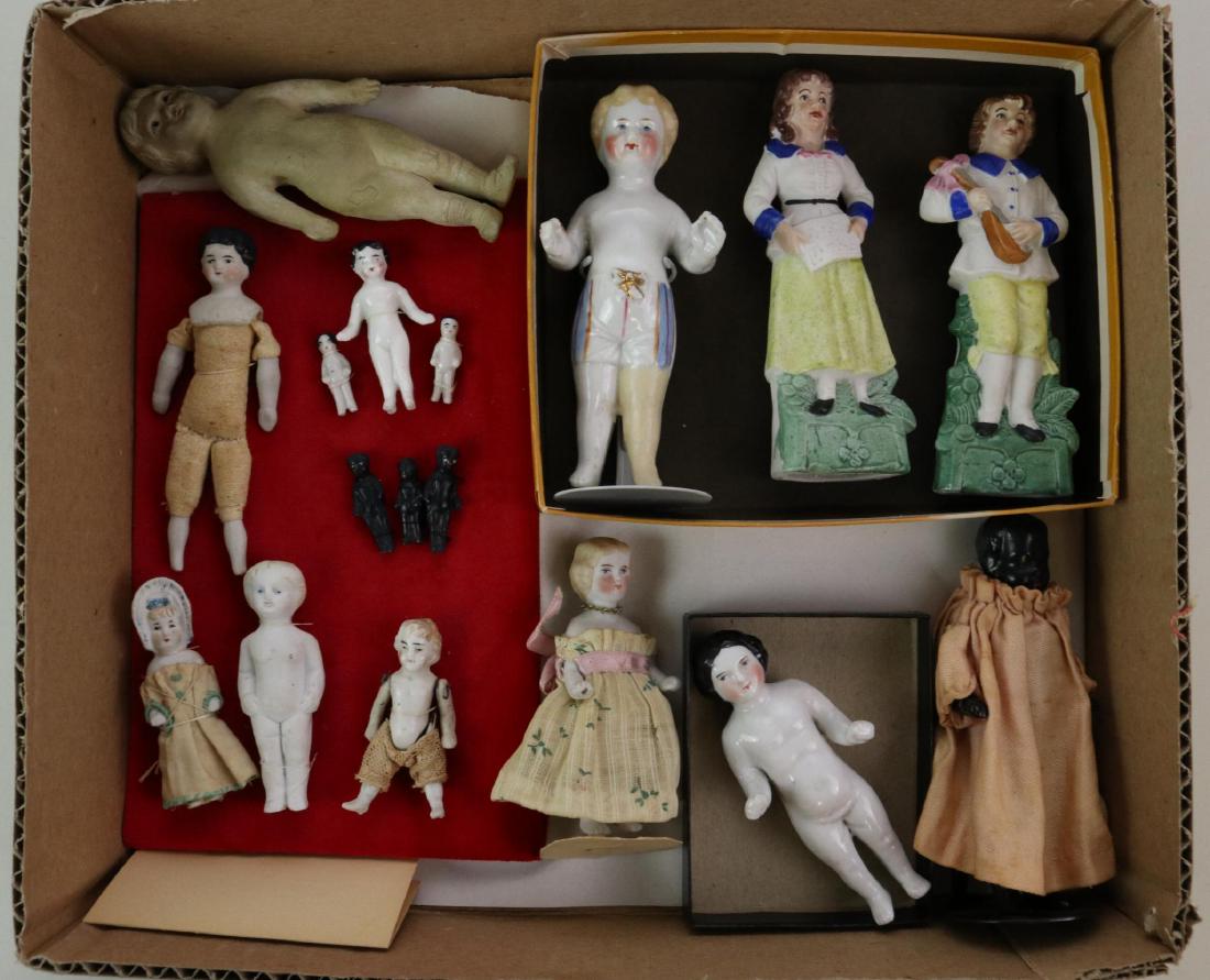 LOT OF CHINA/PARIAN DOLL(S).: Lot of antique china and parian dolls and figurines. China - (11) Frozen Charlie immobile style dolls inc. (4) black ones, 1"- 4 1/2". Condition: 4 1/2" doll with painted clothing has been repaired. 4