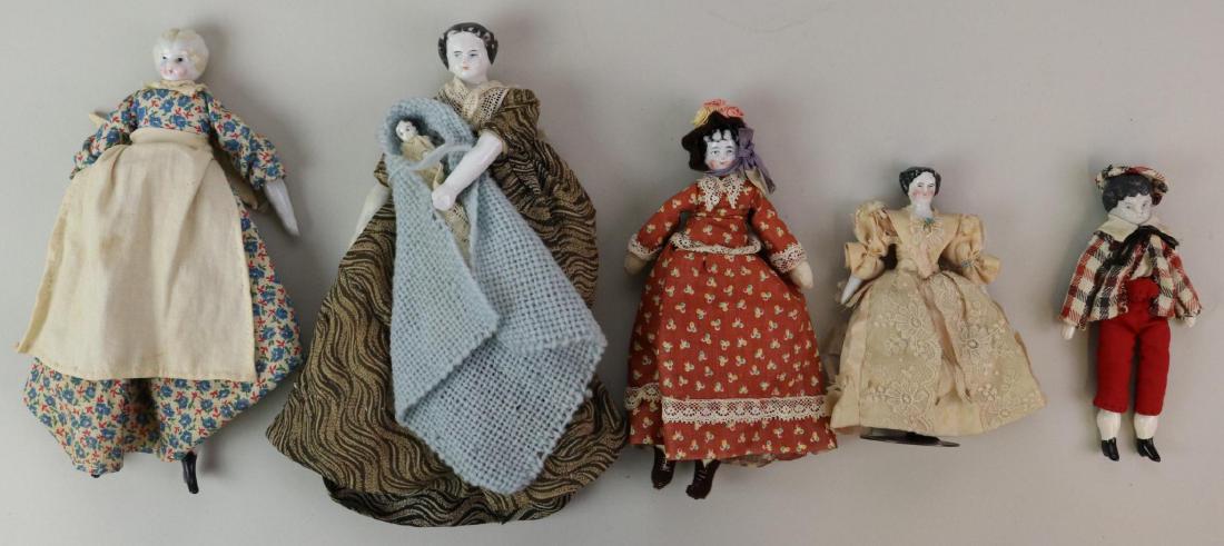 LOT OF CHINA/PARIAN DOLL(S).: Lot of (5) antique china head dolls. (3) Lowbrows wearing vintage clothing - 5 1/2" doll (with replaced body/limbs, repaint). 6 3/4" Doll with replaced cloth body. 8 3/4" Blonde doll with replaced bod