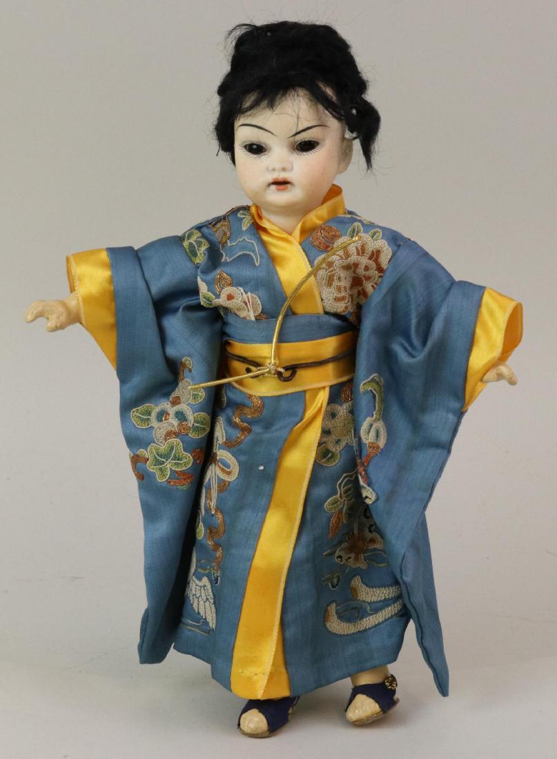 ANTIQUE ASIAN BISQUE HEAD DOLL,: 10" 6/0 Antique bisque head Japanese doll. Stationary dark brown eyes, open mouth, black mohair wig. Papier mache jointed body. Dressed in embroidered silk kimono with obi sash. No underwear, newer sa
