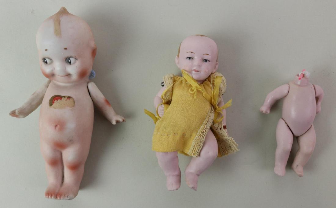 LOT OF ALL BISQUE.: LOT. Pair of dolls - 5 3/4" NIPPON "Kewpie" with label on feet (Rose O'Neill 1913) and partial label on chest. 4 1/2" GERMANY pink bisque baby doll with 5 pc. wire strung baby body. Painted features, 