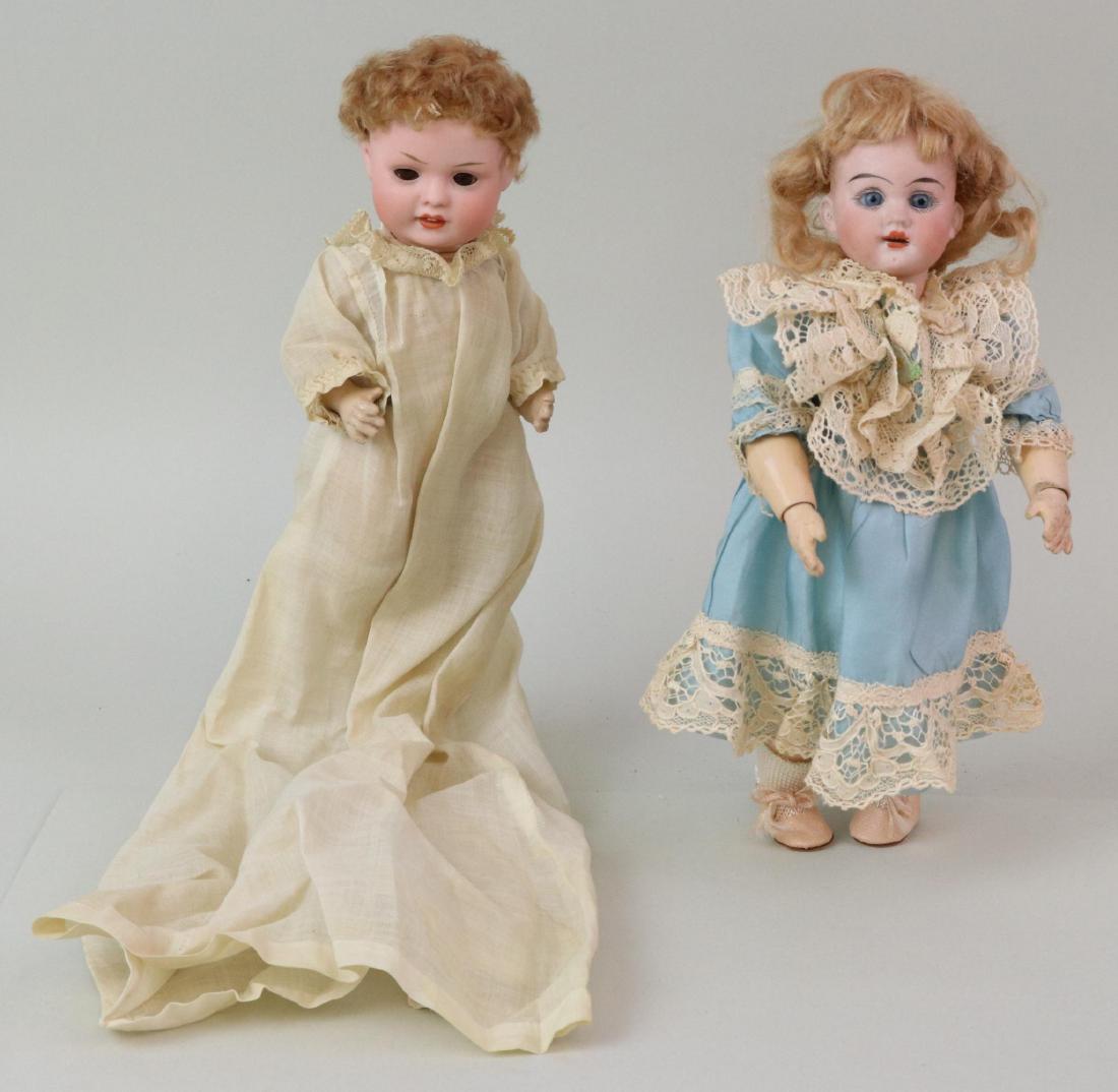 ANTIQUE BISQUE HEAD DOLL(S), 12" AND UNDER.: Pair of dolls. 7 1/2" BXP 585 5/0 Germany character baby with brown sleep eyes, open/closed mouth, caracul wig. 5 Pc. papier mache bent limb baby body. Dressed in antique baby gown, crocheted booties.