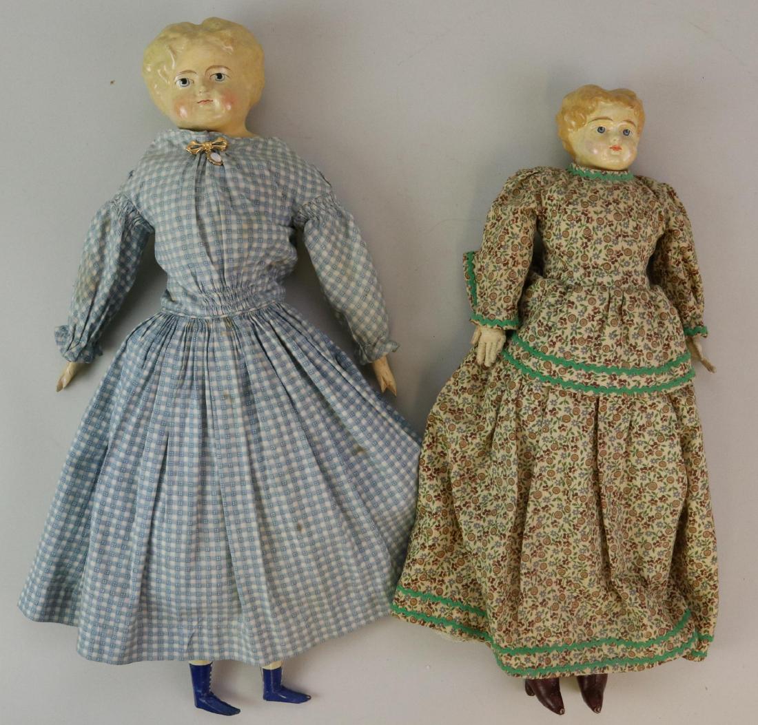 LOT OF PAPIER MACHE DOLL(S).: Pair of dolls. Both dolls have short blonde curly hair, painted blue eyes with feathered eye brows, pale cheek coloring. 16" Doll has a replaced cloth body with leather boots. Beige leather arms with