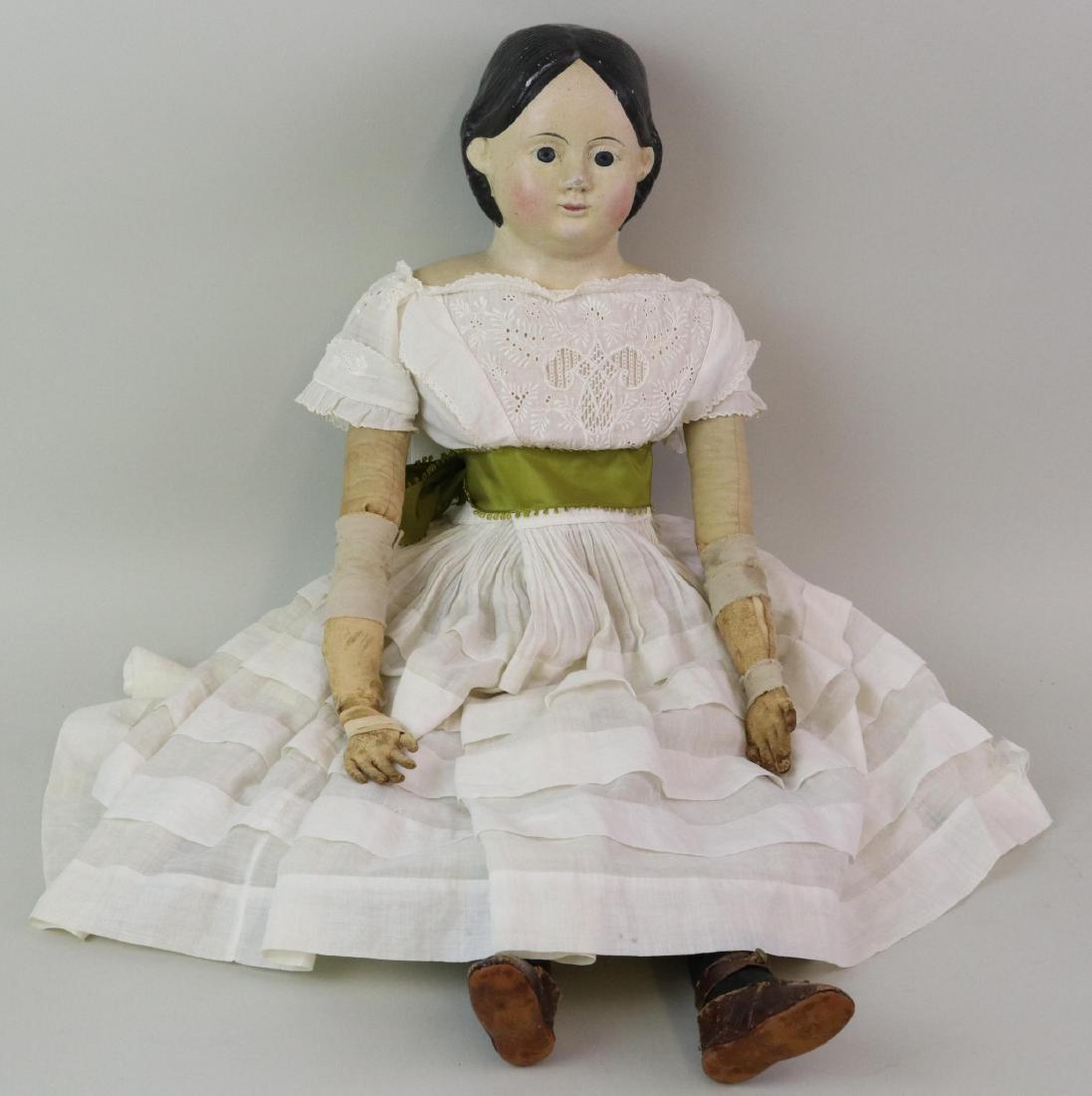 LOT OF PAPIER MACHE DOLL(S).: 27" All original Greiner '58 doll. Marked GREINER'S Improved PATENT HEADS Pat. March 30th, '58. Paper under the skirt reads: Emma Darlington Heed's Doll 1855. Ca. 1850. Black hair, dark blue eyes. Ori