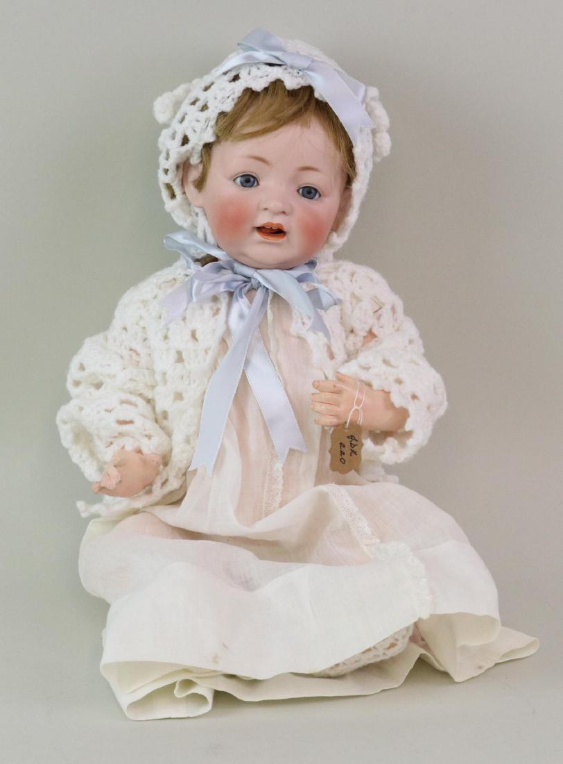 ANTIQUE BISQUE HEAD BABY DOLL.: 16" T. Made in Germany 13 J.D.K. Z. 220. Z. character baby with blue sleep eyes, open mouth with woggle tongue. Brown human hair wig. Very clean 5 pc. papier mache bent limb baby body. Dressed in anti
