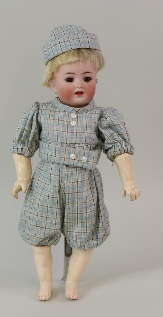 ANTIQUE BISQUE HEAD BABY DOLL.: 11 1/2" K * R SIMON & HALBIG 126 Germany 24 character baby head. Brown sleep eyes, open mouth, blonde mohair wig, plaster pate. Head should probably be on a 5 pc. bent limb baby body but it is on a ve