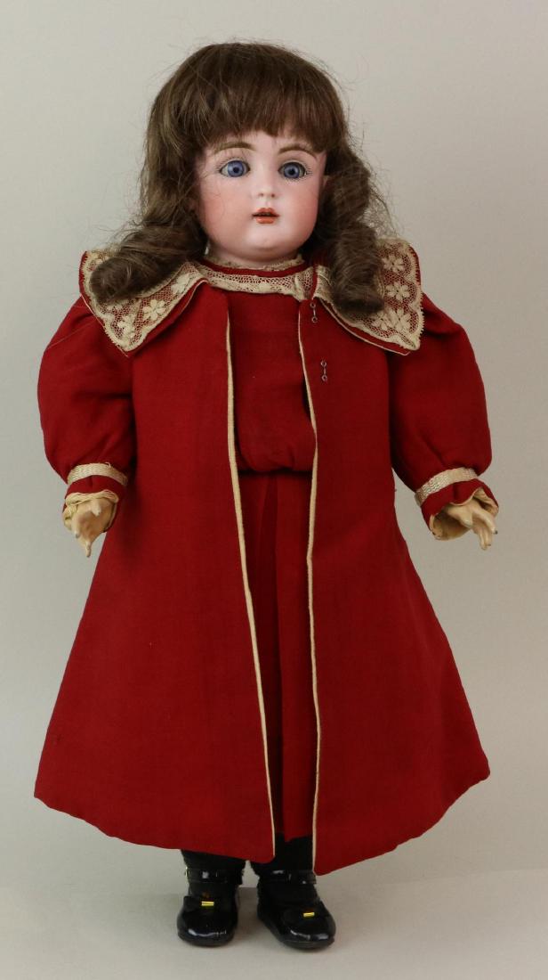 ANTIQUE BISQUE HEAD GERMAN DOLL.: 17 1/2" C 1/2 Made in Germany 7 1/2 167 with blue sleep eyes, open mouth, brown human hair wig, plaster pate. Papier mache ball jointed body marked (red stamp) GERMANY. Dressed in antique red wool dre