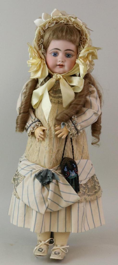 ANTIQUE BISQUE HEAD GERMAN DOLL.: 22" S 12 H 719 DEP with stationary blue eyes, open mouth, pierced ears, very long curly honey blonde French human hair wig. Papier mache ball jointed body. Dressed in reproduction drop waist silk dres