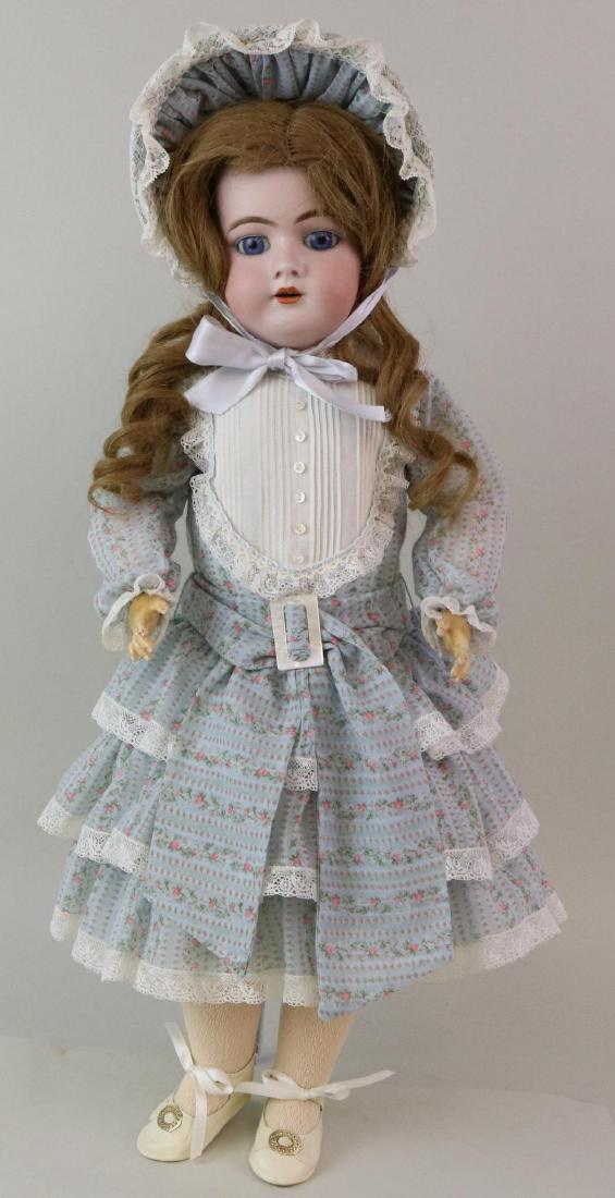 ANTIQUE BISQUE HEAD GERMAN DOLL.: 23" 11 1/2 99 DEP Germany HANDWERCK 3 with stationary blue eyes, open mouth, pierced ears, brown human hair wig. Papier mache ball jointed body. Doll has been dressed in attractive newer dress with ma