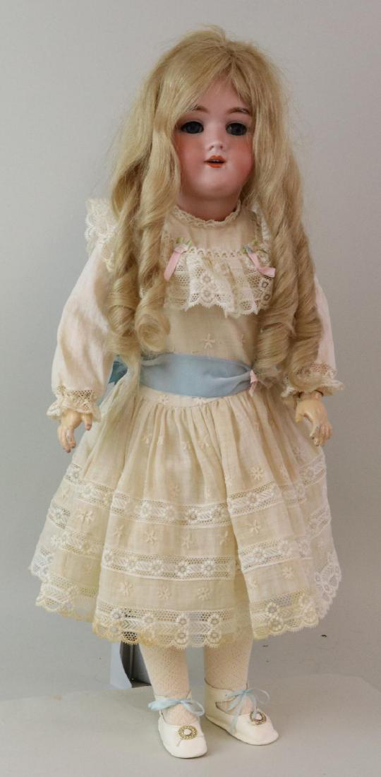 ANTIQUE BISQUE HEAD GERMAN DOLL.: 25" Germany HEINRICH HANDWERCK SIMON & HALBIG 5 with blue sleep eyes, open mouth, pierced ears, long blonde curly French human hair wig. Papier mache ball jointed body. Dressed in clothing made from a