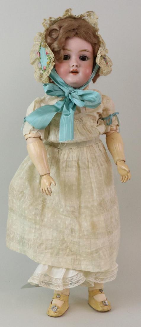 ANTIQUE BISQUE HEAD GERMAN DOLL.: 20" 119 - 10 1/2 X HANDWERCK Germany 2 1/4 with brown sleep eyes, open mouth, brown curly mohair wig. Papier mache body is marked (red stamp) GERMANY 3361. Dressed in antique white cotton clothing - d