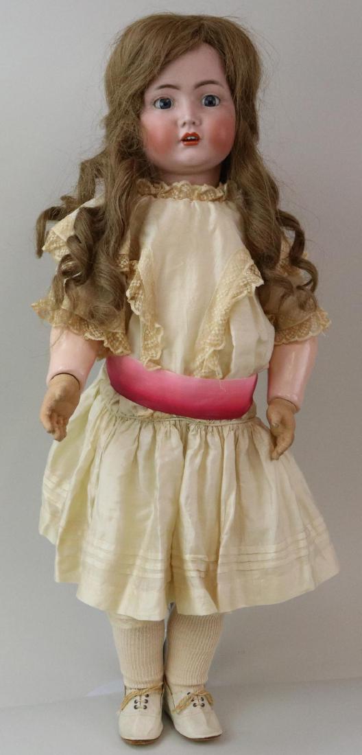 ANTIQUE BISQUE HEAD GERMAN DOLL.: 28 1/2" K * R SIMON & HALBIG 117n Germany 90 with blue sleep eyes, open mouth, brown human hair wig. Very clean papier mache ball jointed body. Rubber hands. Dressed in antique silk dress with lace de