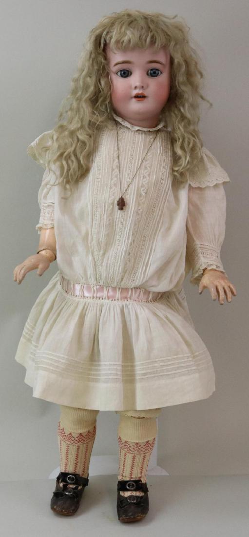 ANTIQUE BISQUE HEAD GERMAN DOLL.: 30 1/2" 109-15 DEP Germany HANDWERCK with blue sleep eyes, open mouth, pierced ears, long blonde mohair wig. Papier mache ball jointed body is marked (red stamp) Heinrich Handwerck Germany. Crier hole