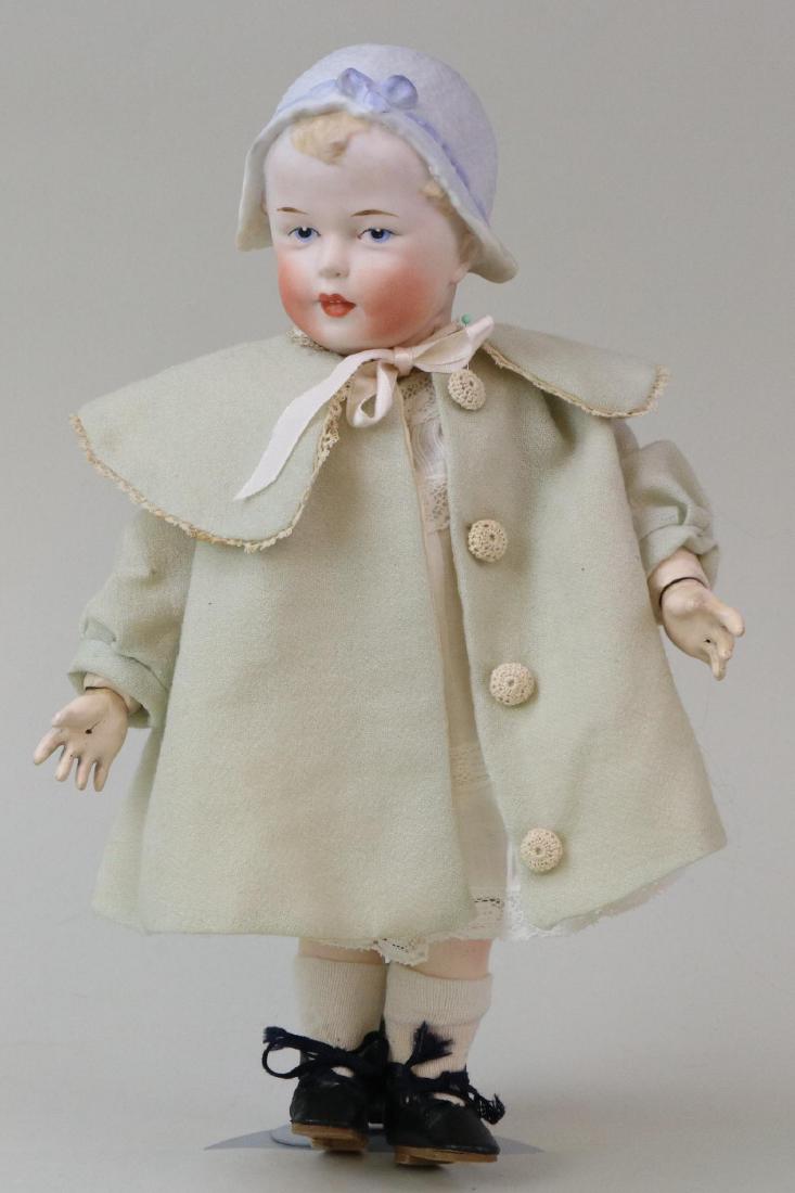 ANTIQUE BISQUE HEAD DOLL(S), 12" AND UNDER.: 11 1/2" HEUBACH (in square) Molded bonnet doll with blue integlio eyes, open/closed mouth, molded blonde hair. Bonnet has molded blue bow. Very clean papier mache ball jointed body. Dressed in antique