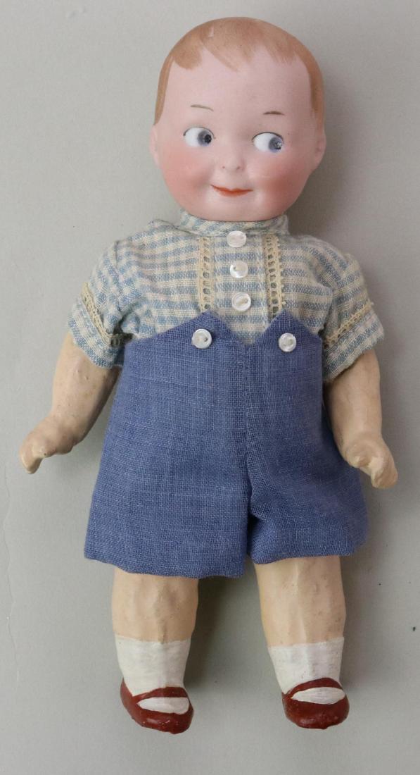 GOOGLY EYE DOLL LOT.: 6" D.R.G.M. A.11/0.M. Germany character boy doll with molded, painted features. Blue side glance integlio eyes, watermelon smile, dark blonde hair. 5 Pc. papier mache toddler body with painted 1-strap