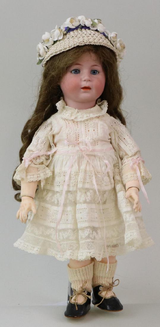 ANTIQUE BISQUE HEAD GERMAN DOLL.: 14" 1488 SIMON & HALBIG 6 character doll with blue sleep eyes, closed mouth, very long brown human hair wig. Fully jointed papier mache toddler body. Dressed in antique cotton lace dress, white lace s
