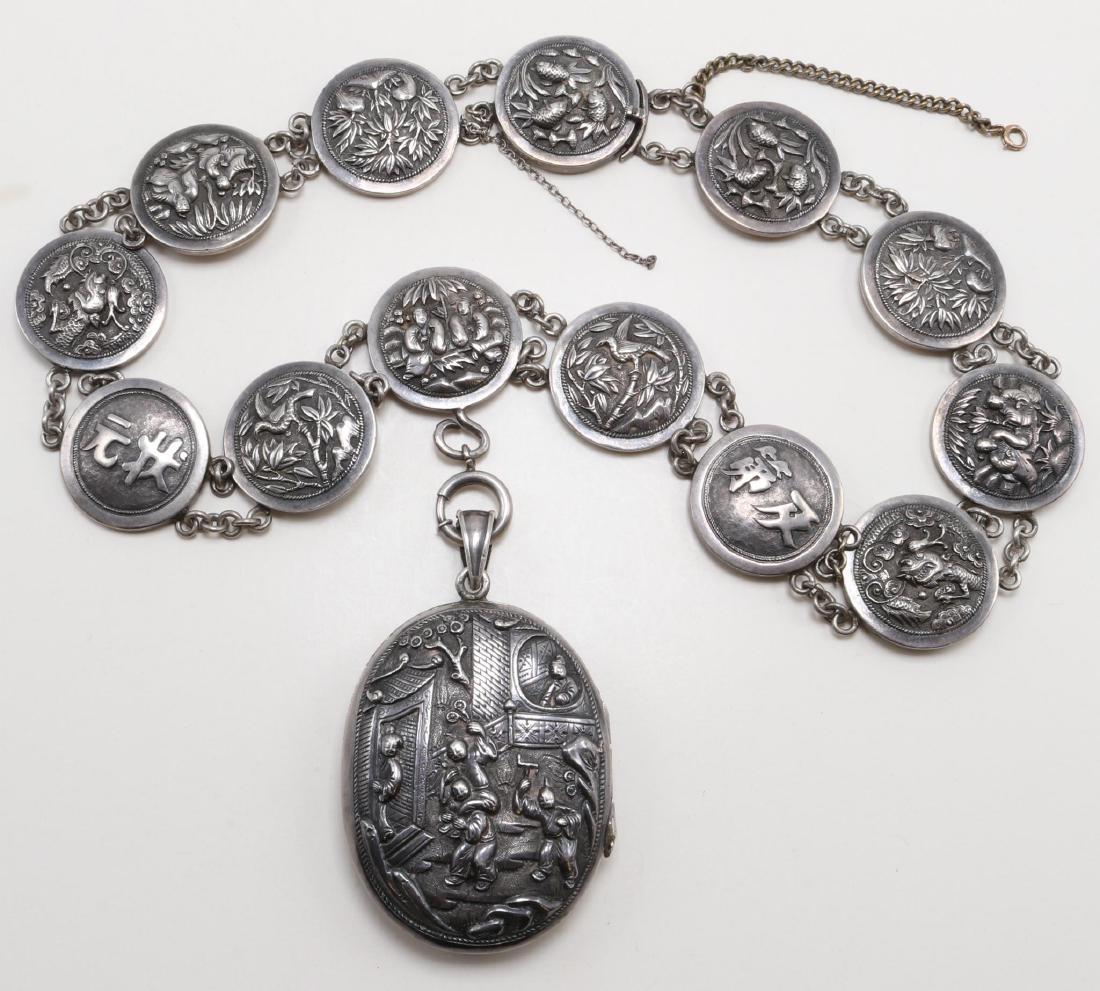 Necklace, Locket Pendant. Wang Hing 90. Chinese Silver: 17 1/4" long necklace features (13) 25mm diameter disk panels which include an invisible pressure tongue clasp with maker's mark. Panel designs are symmetrical along each side and meet in center wit