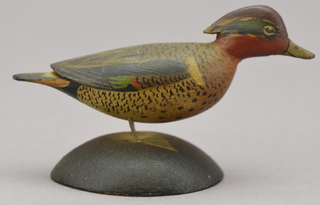 A.E. Crowell Miniature Green Winged Teal Hen: Anthony Elmer Crowell (East Harwich, Massachusetts, 1862-1951) carved and painted miniature green winged teal hen, with impressed rectangular stamp on base. Minor scuffing to the paint on the neck. 3.