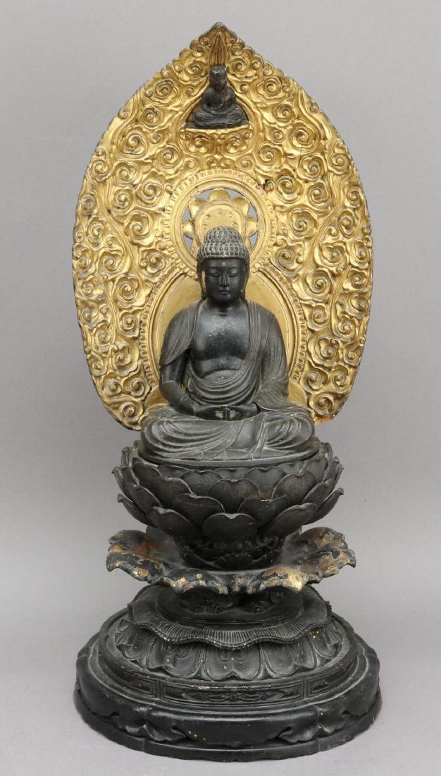 Carved Giltwood and Painted Buddha Sculpture: Buddha seated and perched on an artichoke and pattern molded base, 21"h.