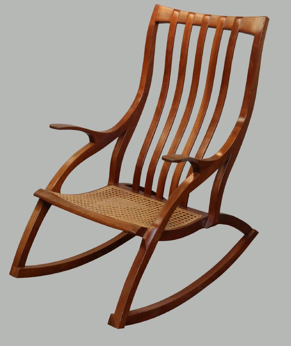 Cherrywood Rocking Chair: Caned woven seat. 39"h x 24"w x 39"d